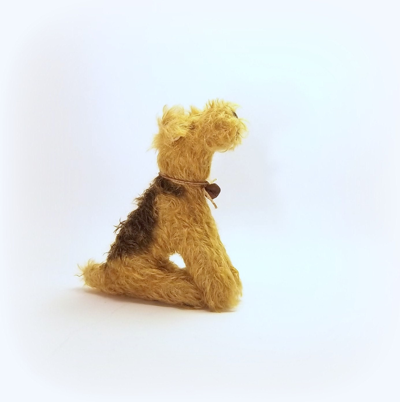 little sitting Airdale / Lakeland terrier mohair dog