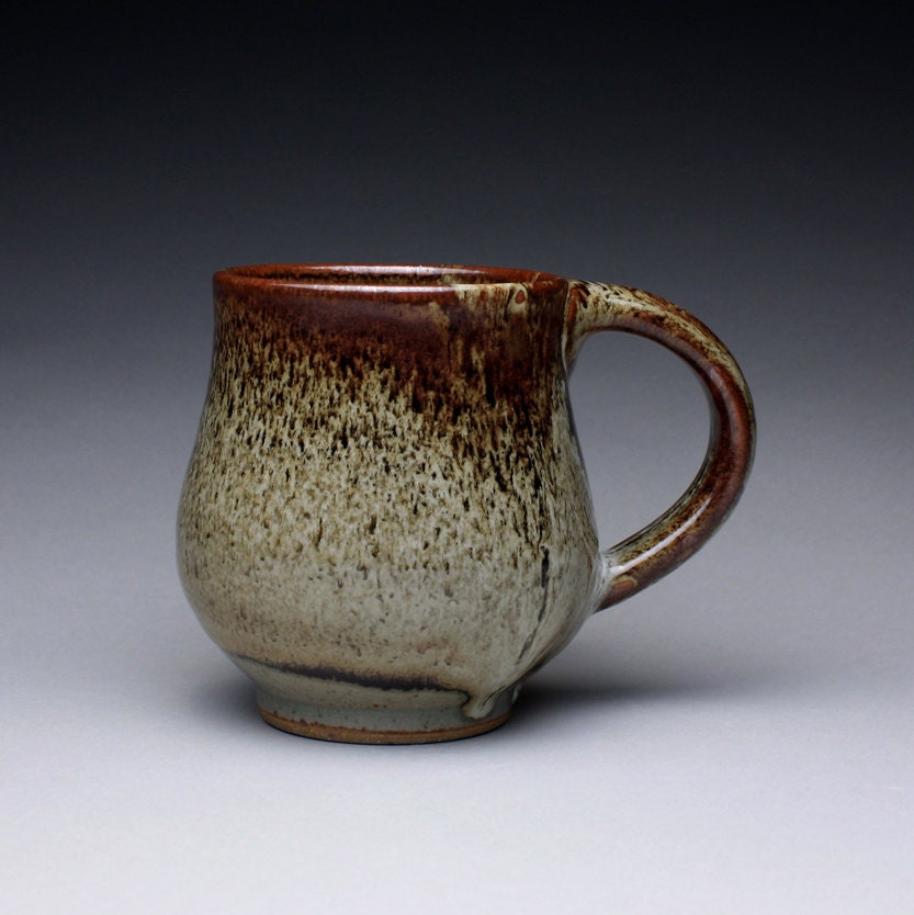 handmade pottery mug, ceramic cup, teacup with black tenmoku and wood ash glazes