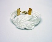 White knotted nautical rope bracelet with gold anchor charm