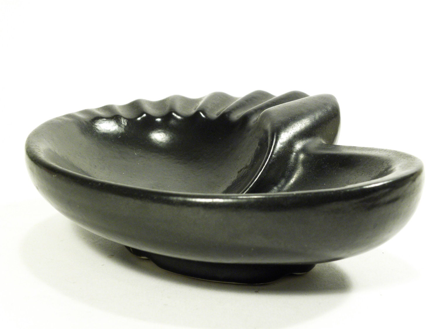 atomic ashtray bowl . ceramic gunmetal or ebony glaze . asymmetrical organic shell shape . mid century modern vintage 1950s 1960s by Norma