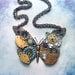 Steampunk Butterfly Necklace - Silver Butterfly with Watch Gears Brass Flowers and Jewels in Royal and Light Blue