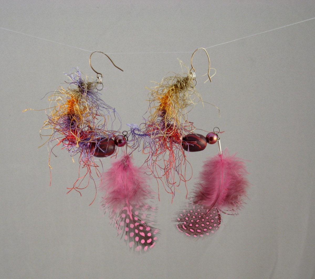 Hoop feather earrings dangle in pink handmade clay beads fiber wrapped