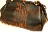 black handbag with brown tree