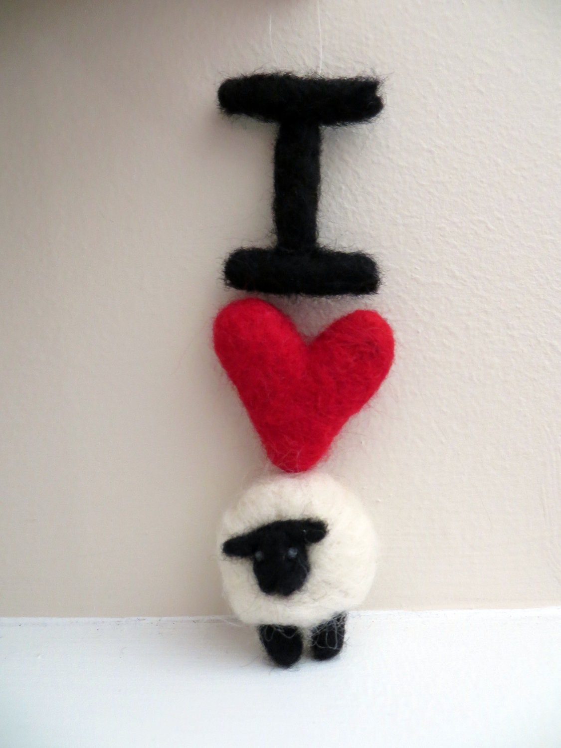 I Love Ewe, or I Heart Sheep, you make the call.  Needle felted ornament of looooove.