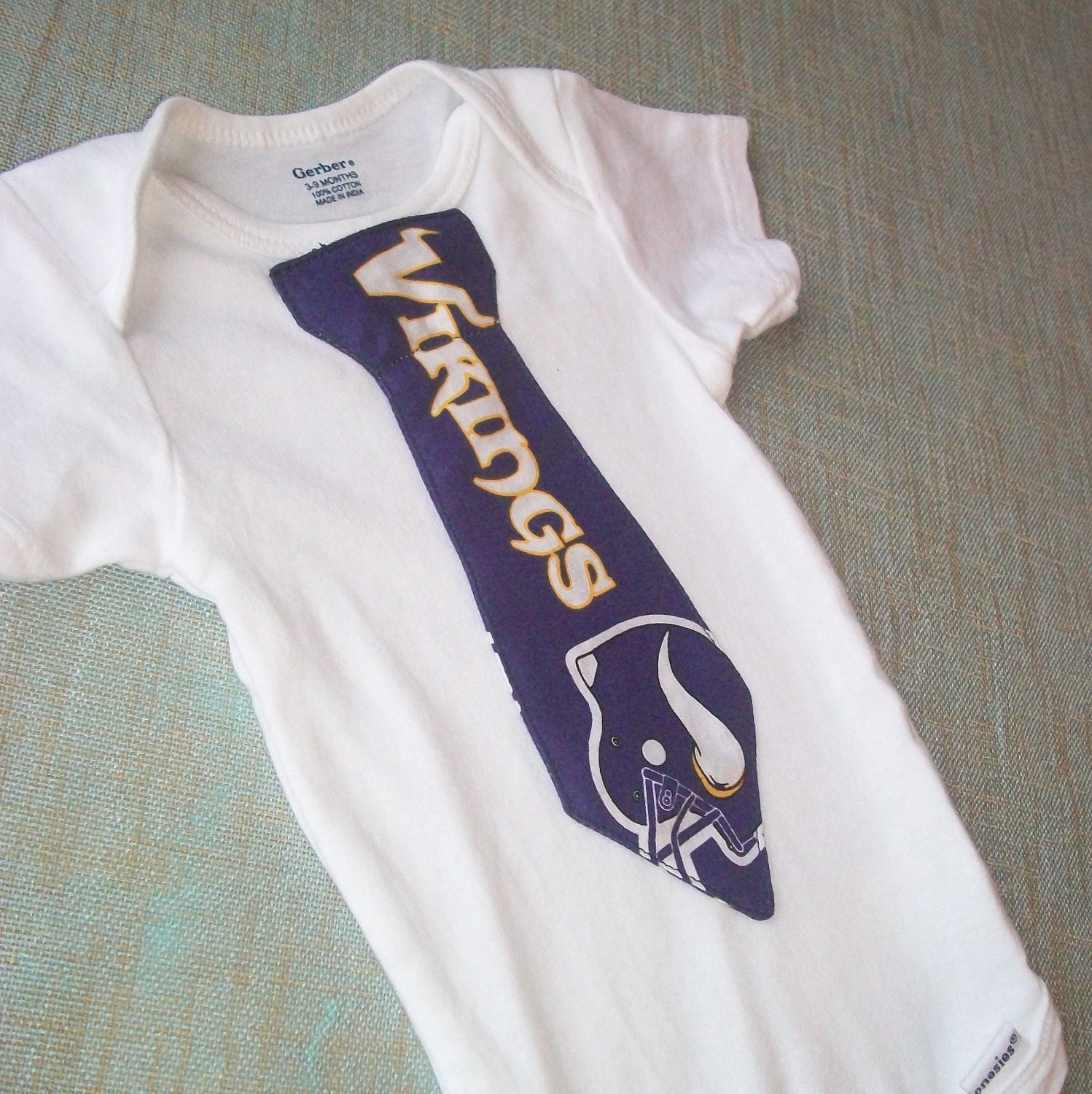 NFL tie onesie or shirt, Minnesota Vikings football, need a different team, just let me know.