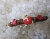 vintage  barrette sweet little cherub or cupid , angel running with a stolen heart