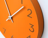 orange spice wall clock with modern numbers