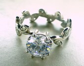 Engagement ring with leaves.   14k gold and white sapphire.