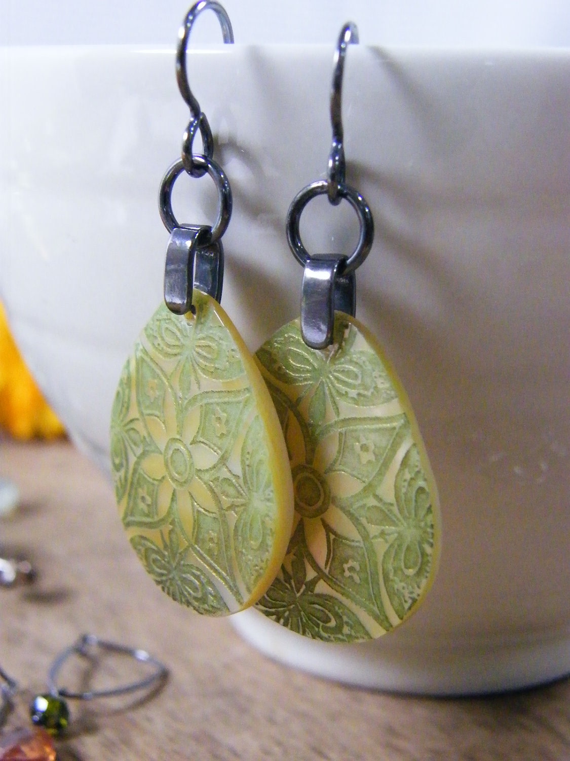 carved shell earrings olive green