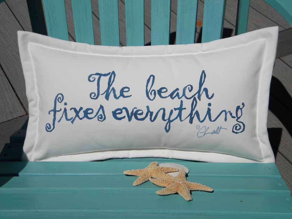 The BEACH FIXES EVERYTHING  indoor outdoor pillow blue lettering on white background 12"x20" handpainted coastal tides Crabby Chris Original