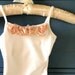 Girls pink or white camisole style lined leotard-- with coordinating shabby chic chiffon blossom.