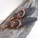 Long Oval Lava Earrings With a Copper Wrap