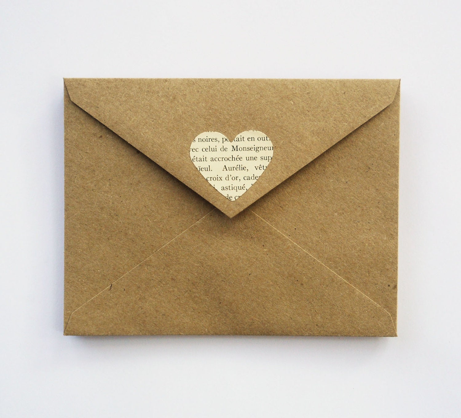 brown kraft envelopes with book page hearts