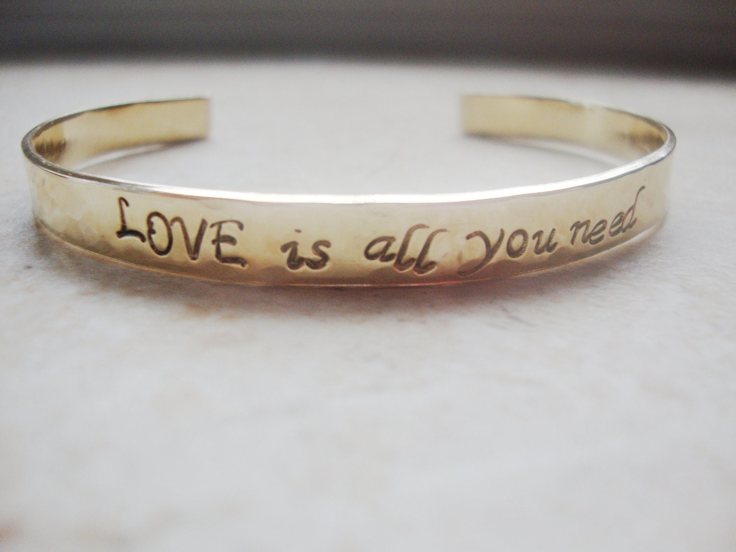 Love is all you need brass hammered hand stamped cuff
