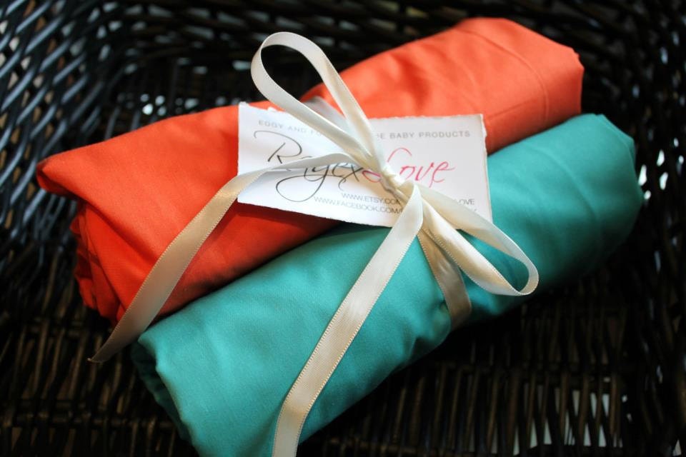 Orange or teal fitted crib sheet