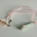 Soft Green Handmade Porcelain Pendant with Pink Flower Applique