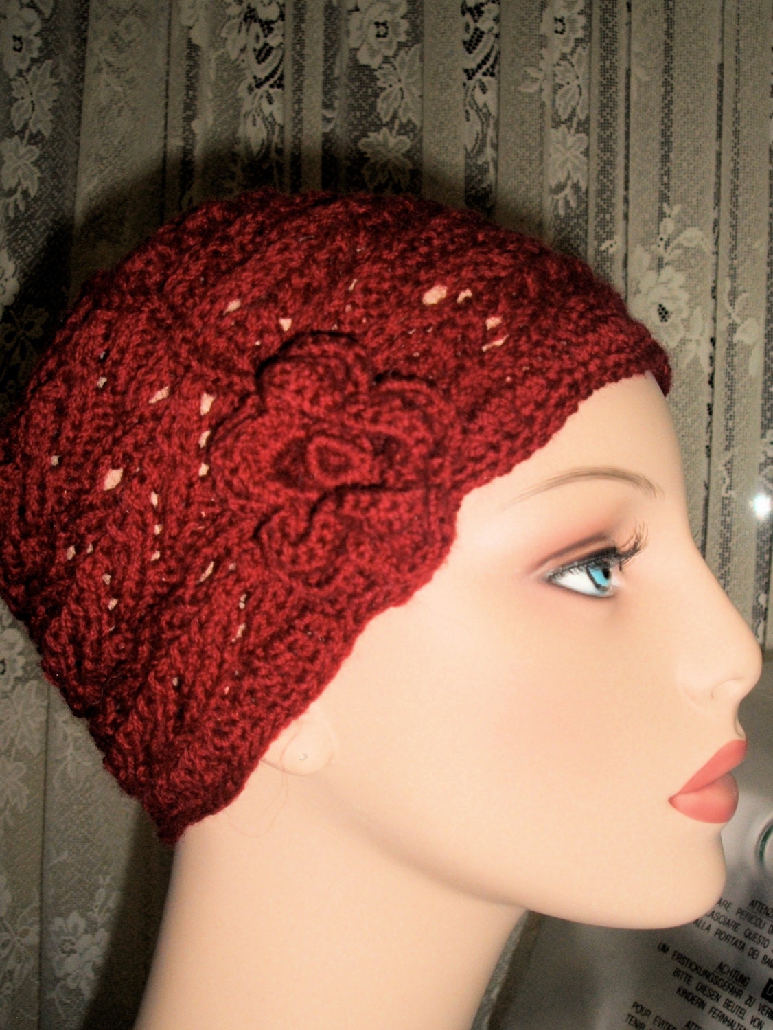 Ladies hand knitted hat with flower.