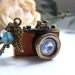 the tan leather camera necklace.