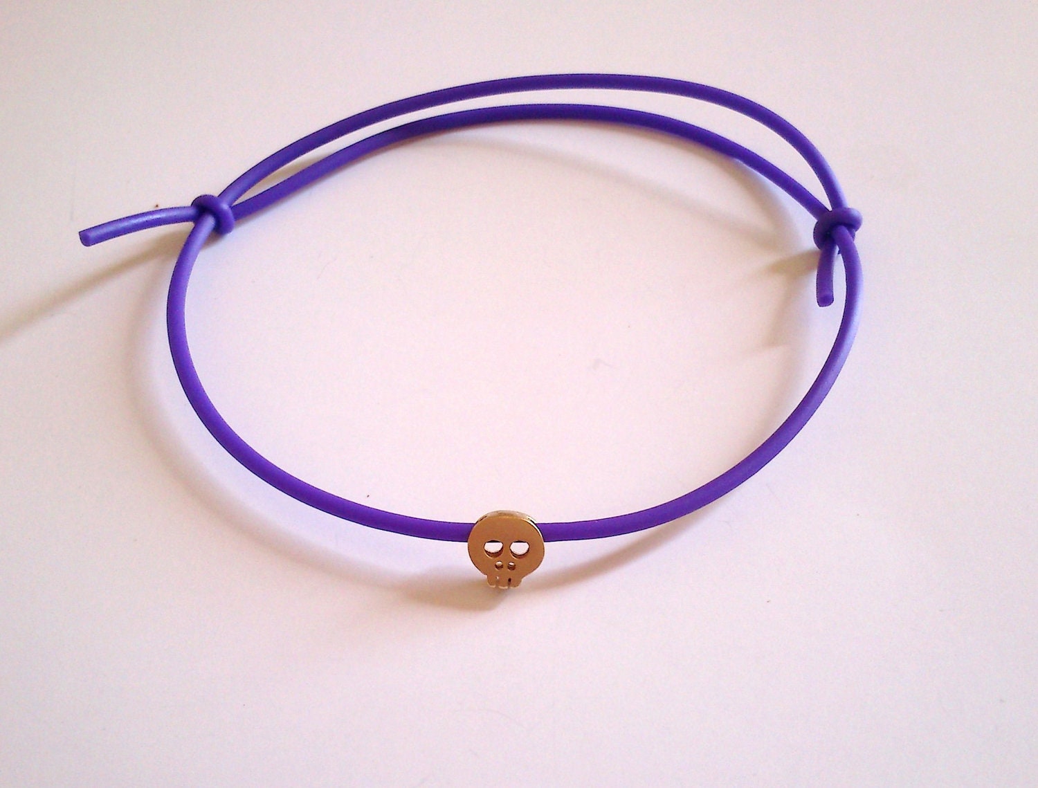 Tiny Skull Bracelet - Purple Rubber With Tiny 14K Gold Plated Skull