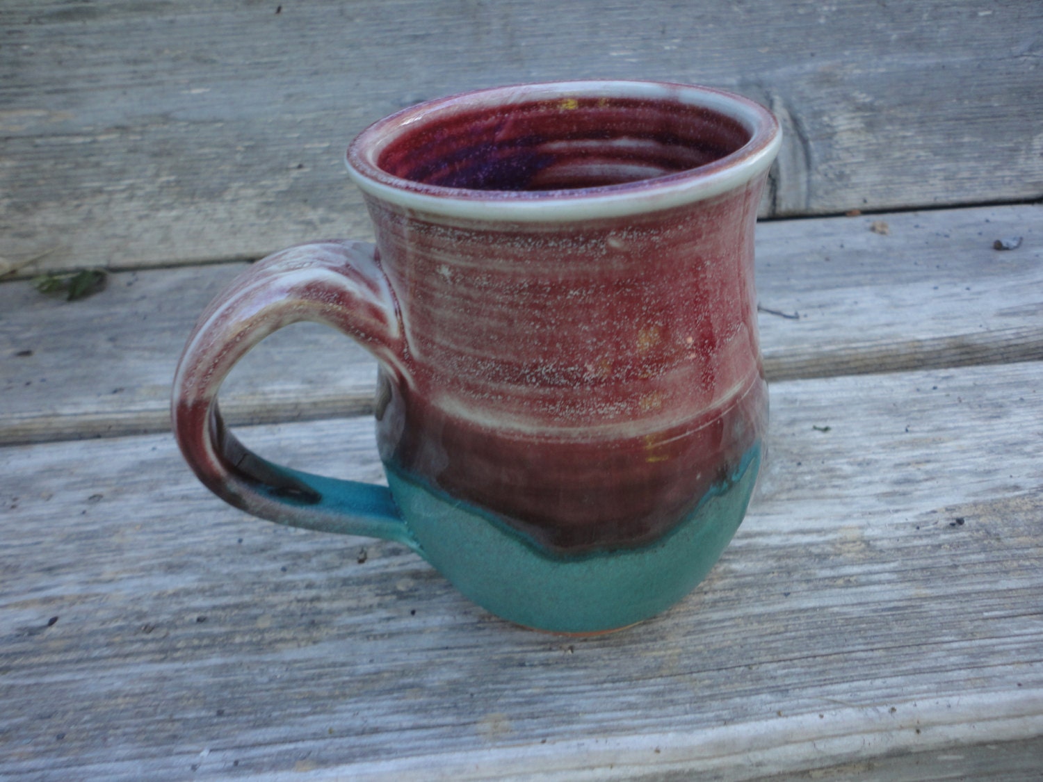 Pottery mug in Raspberry Red and turquoise