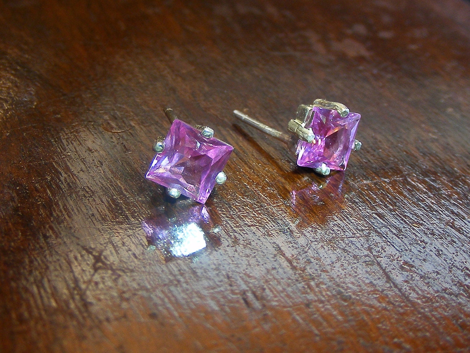 Pink princess cut sapphire earrings.