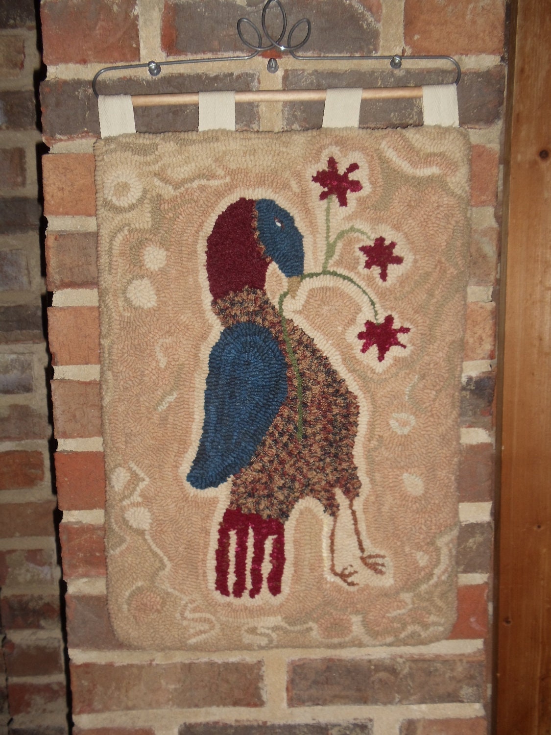 Folk art antique bird hand hooked wall hanging, fiber art, blue, red, cream, plaid wool, hand dyed