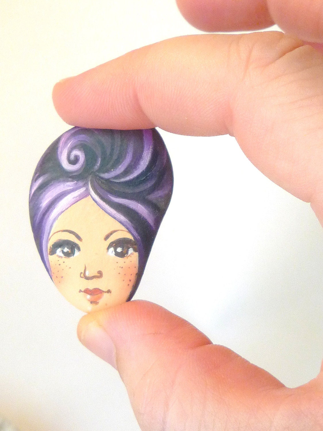 Painted stone. cute painting on stone. Beach pebbles art