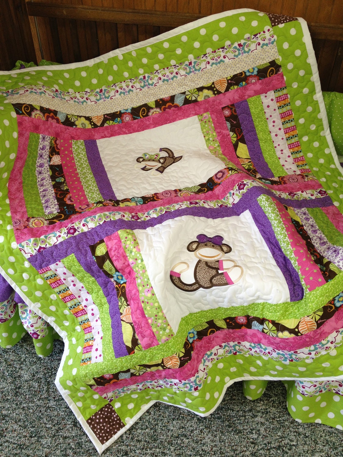 Lime green, pink, brown, and purple baby girl sock monkey quilt