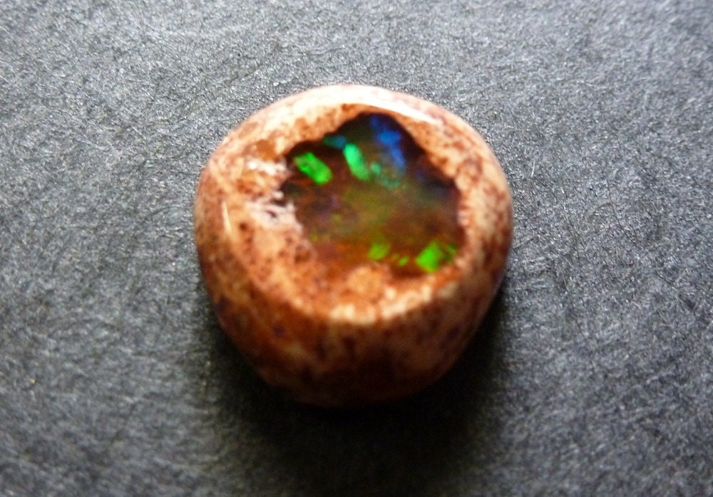 Fire Opal or Mexican Cantara Opal, a dainty delight wrapped in its pretty apricot colored matrix