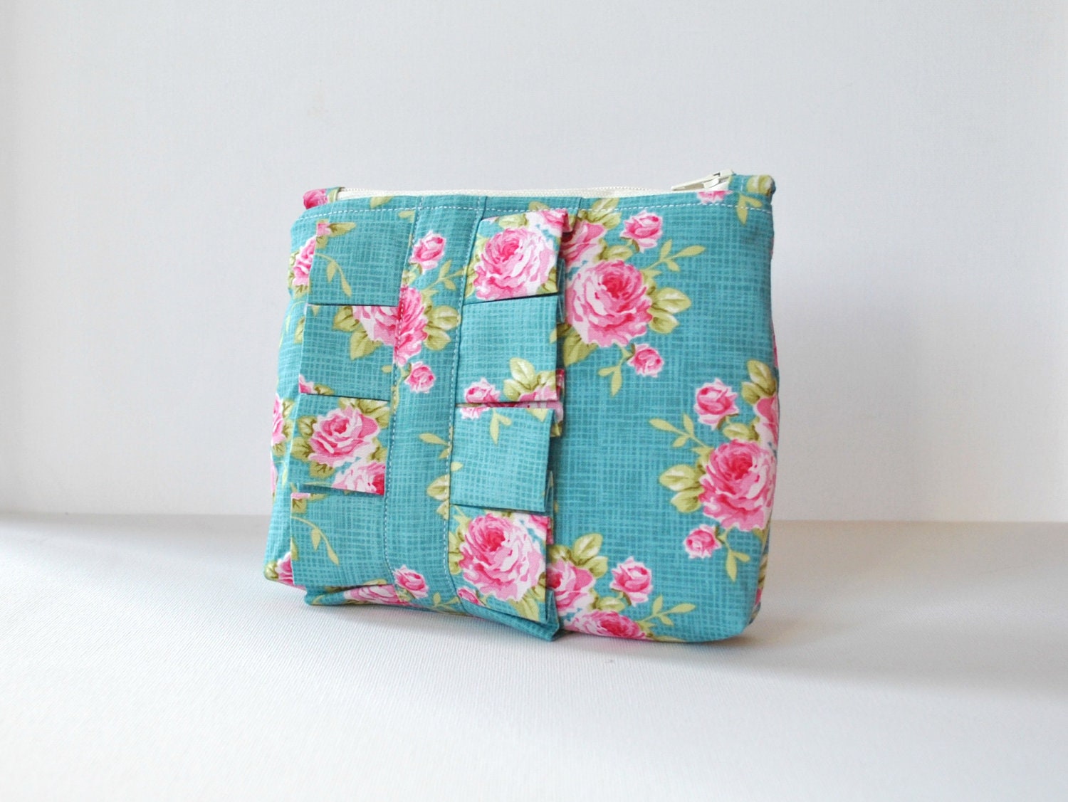 Cosmetics make up bag : Tilda rose print in aqua blue and pink with ruffle.