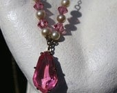 Circa 1920s / 1930s Art Deco Pink Crystal Drop or Dangle Lavaliere Pendant Necklace with Faux Pearls & Pink Bicone Crystal Beads
