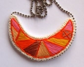 Embroidered jewelry geometric crescent necklace in bright orange pink and tan