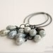 Earrings wire wrapped with antique brass wire with blue czech glass picasso drop beads.