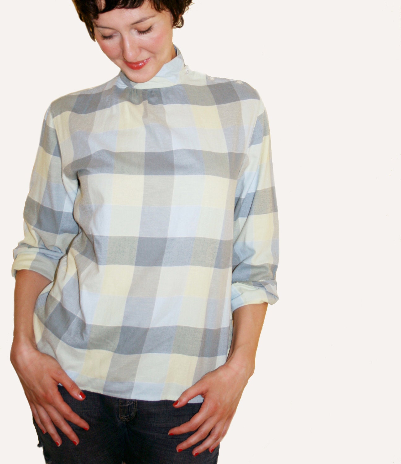 90s plaid blouse, washed-out colors, grunge / tomboy style.