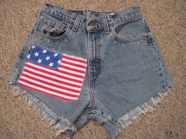 Vintage upcycled Levi denim cut off shorts size 5 High Waisted 28 " waist frayed ripped  with silver star studs and American Flag