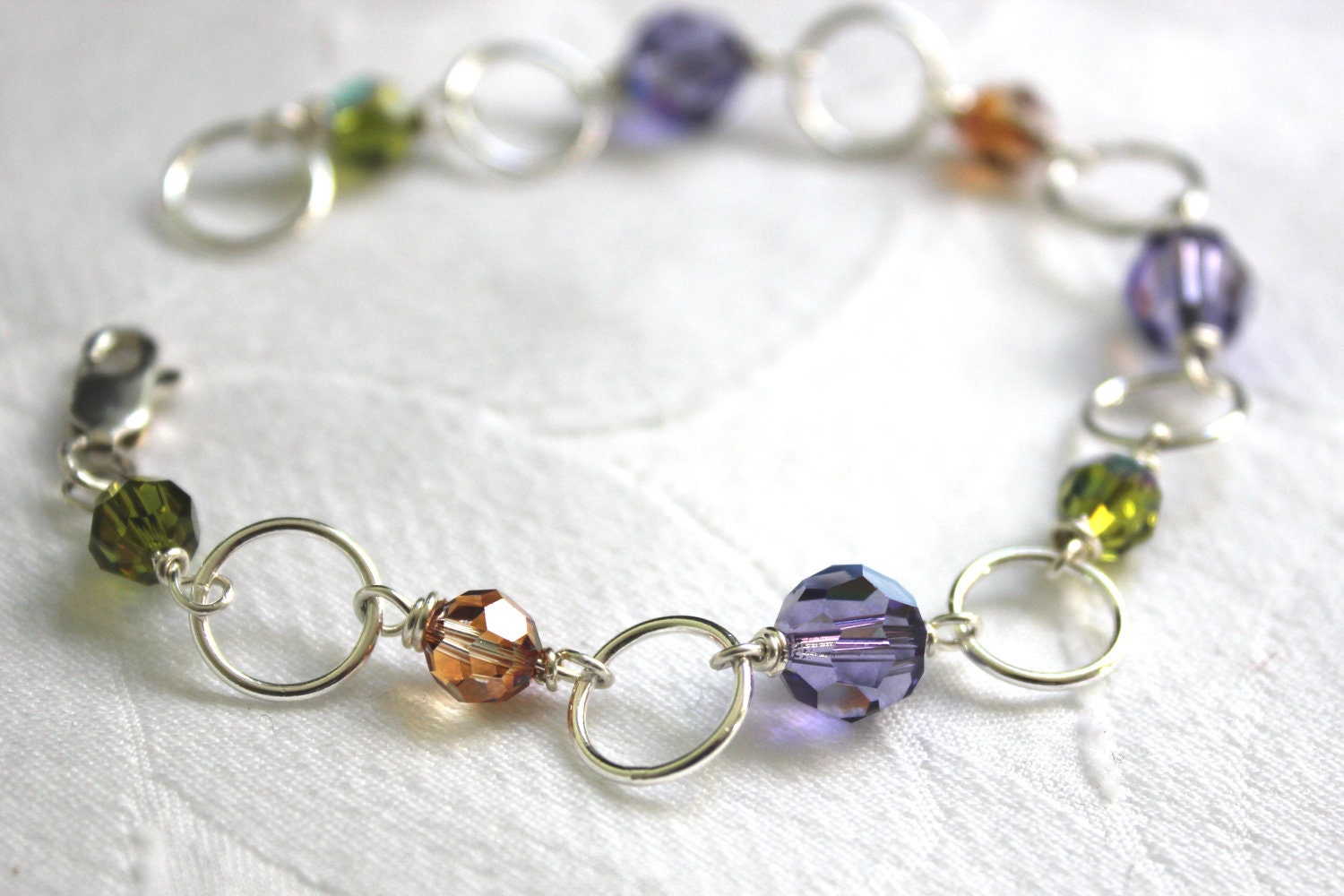 Multi Color Bead Bracelet. Swarovski Crystal and Sterling Silver Circle Link Tanzanite,Copper and Olivine Hand Wire Wrapped Bracelet