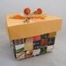 Colorful handwoven paper basket with lid crafted from upcycled paper