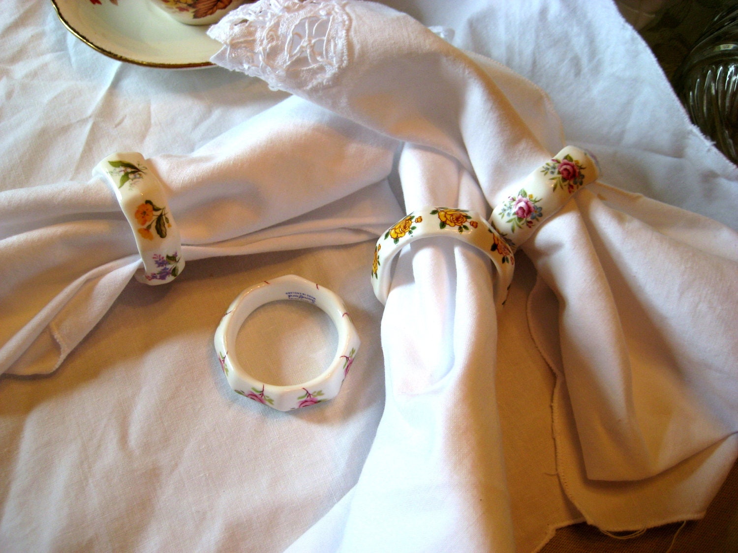 Sanford bone china napkin rings, Made in England, Cottage chic, white with yellow, pink, blue, green flowers, set of four