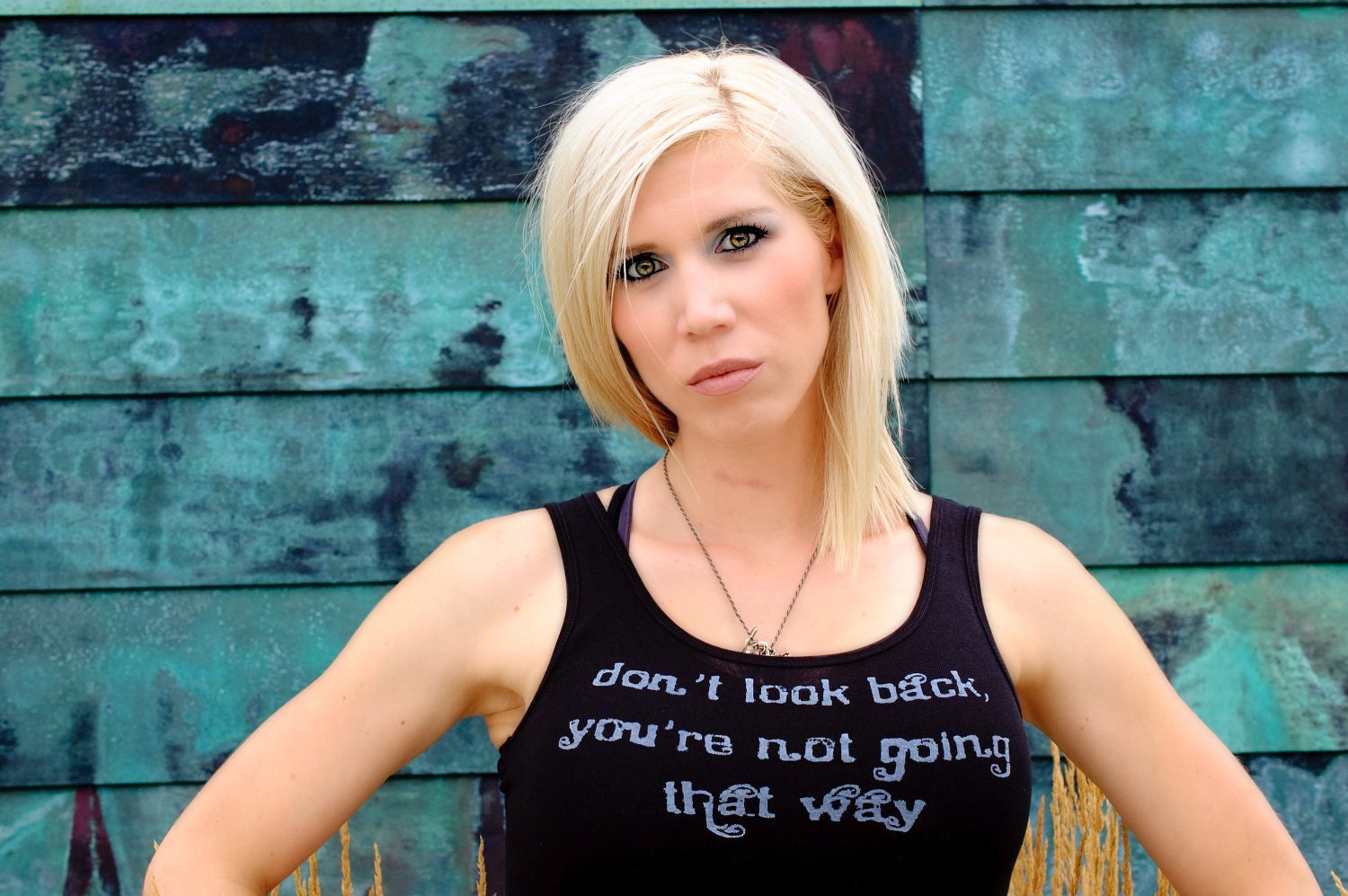 Don't Look Back, You're Not Going That Way done in vintage looking silk screen on a black workout tank with a ruffle trim