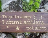 To go to sleep I count antlers, not sheep distressed wooden sign