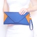 Navy blue and brown felt clutch