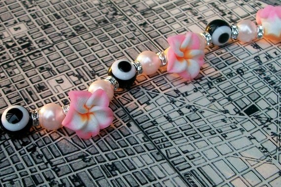 Evil Eye Bracelet with Clay Flowers, Faux Pearls, and Swarovski Crystal Spacers