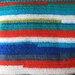 Crocheted hooded striped baby blanket