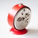 Vintage red mechanical alarm clock "Slava"