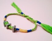 Square Nut and Green Thread Friendship Bracelet