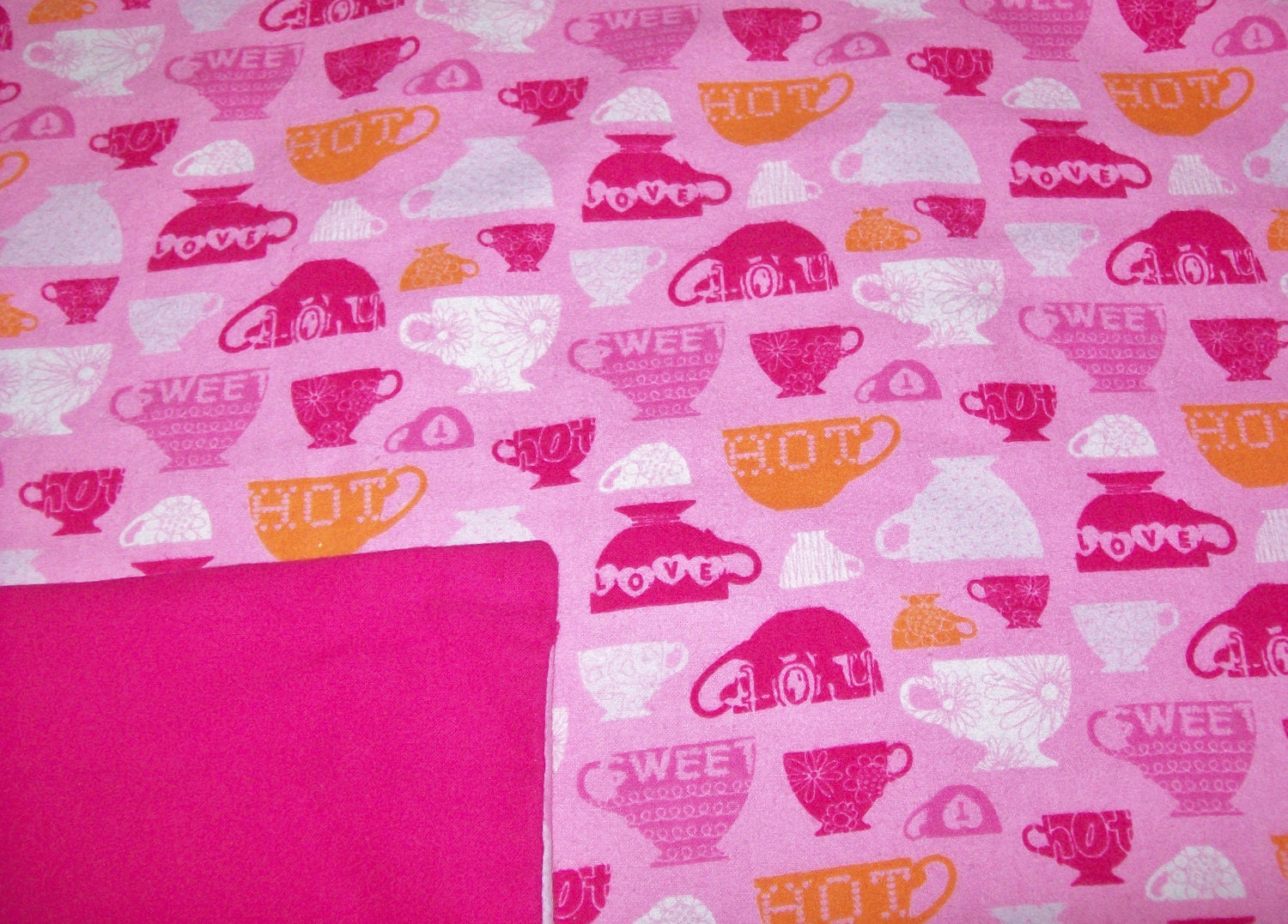 Hot pink flannel baby blanket with teacup print