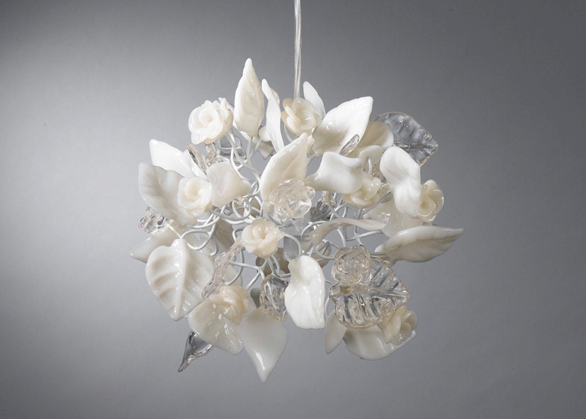 Ceiling chandelier. Crystal clear and white flowers and leaves.