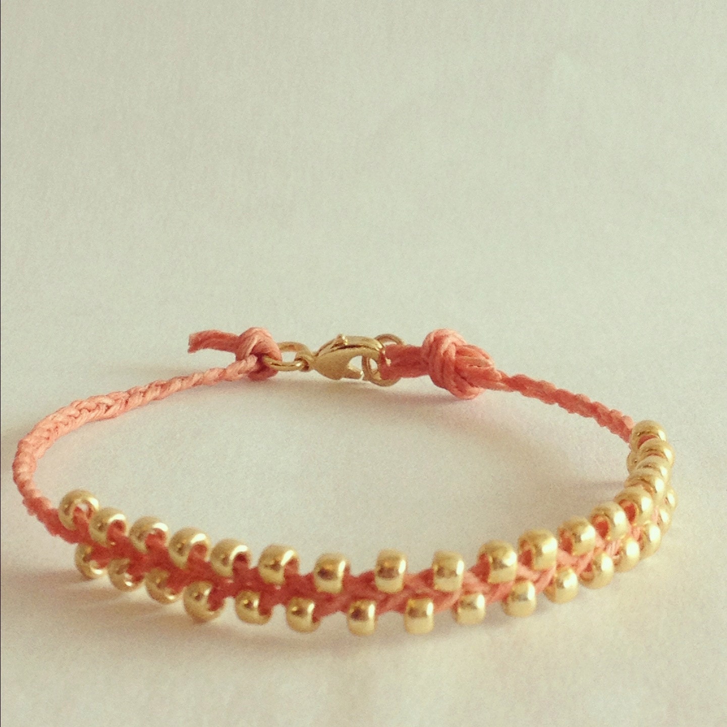 Waxed Linen Cord Bracelet in Salmon with Gold Beads and Lobster Clasp (Lovewrap in Salmon)