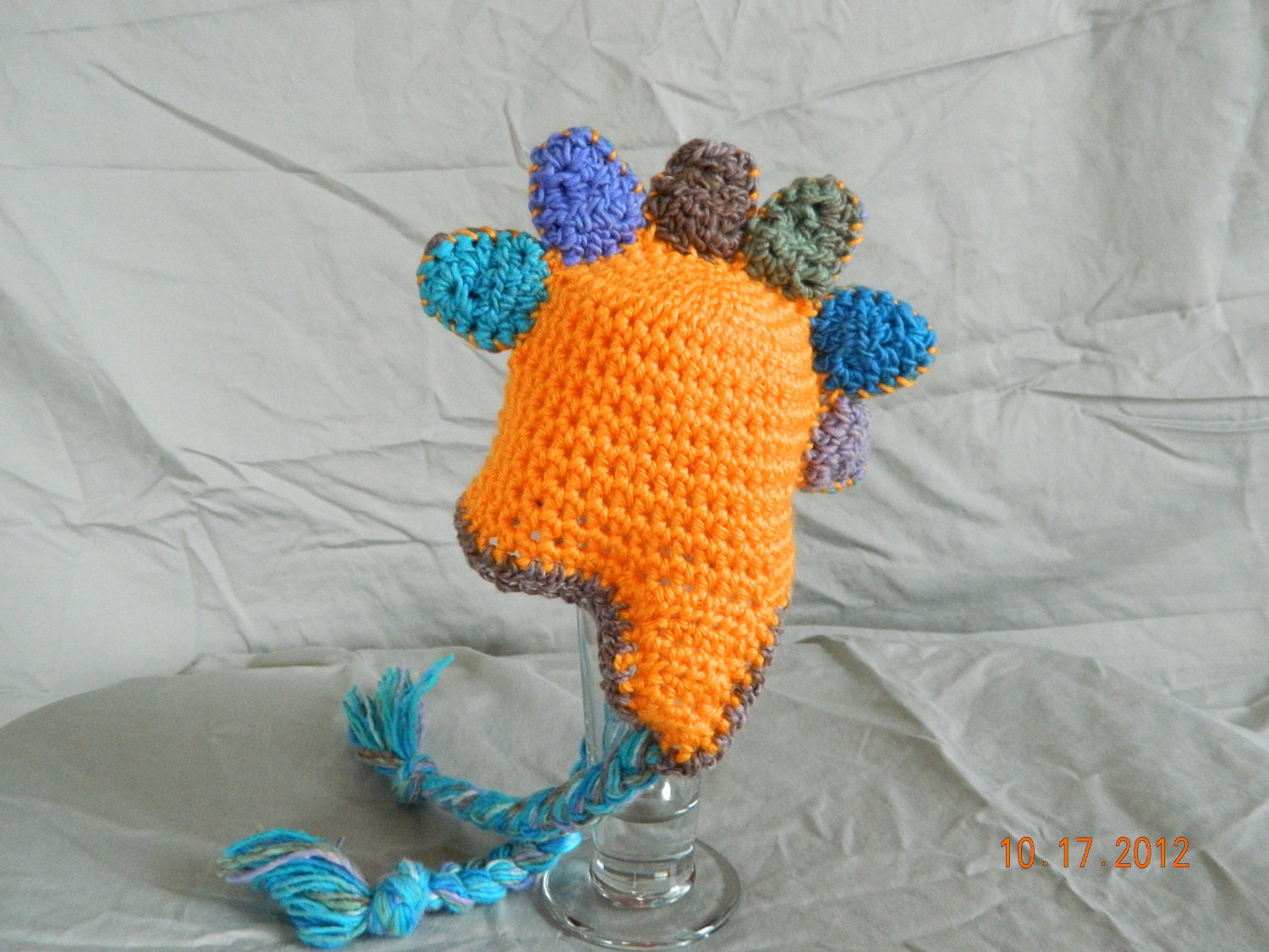 Crochet orange dinosaur hat with earflaps, sizes youth or adult.  Dinosaur, photo prop, teens, adult, children, gift ideas