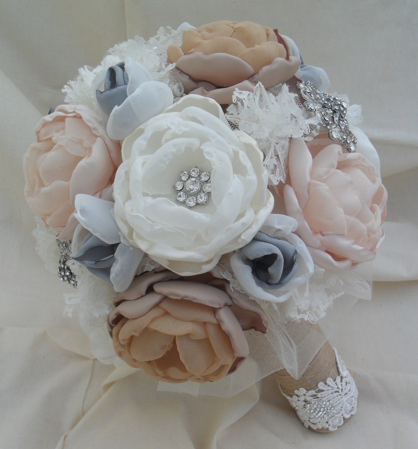 Large rustic vintage fabric bouquet in coral shades with a touch of grey, crystals,brooches, lace and burlap handle